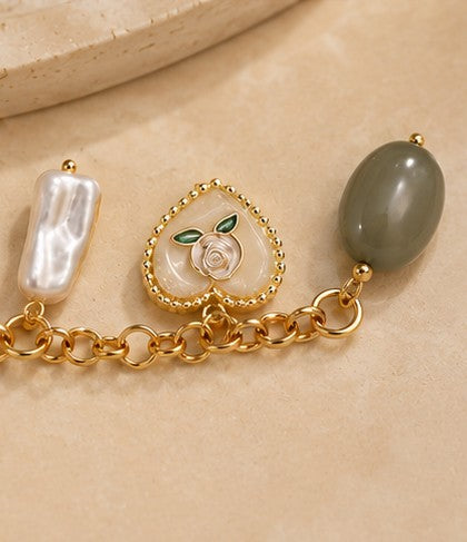 Charms bracelet with beads, pearls, hearts